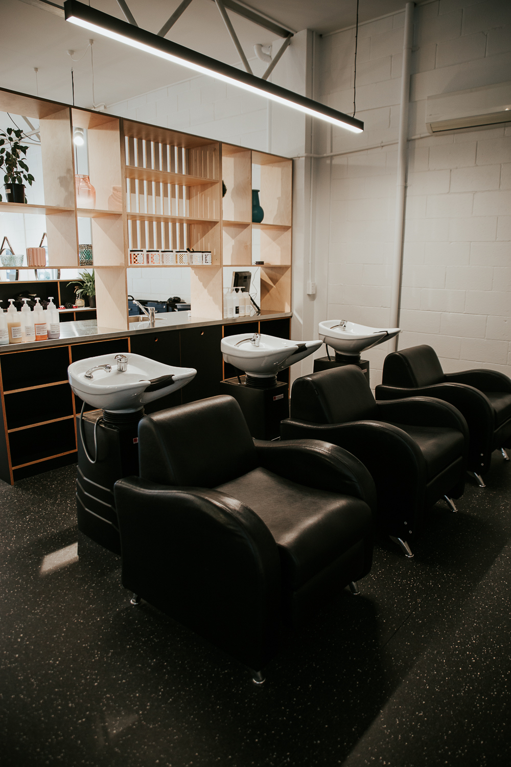 The hair-washing and treatment area at Absolute Hair