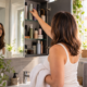 Illustrative image of a woman choosing from hair products in a bathroom cabinet